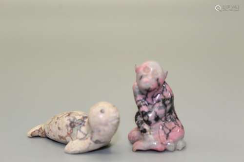 Two Chinese carved stone animals.