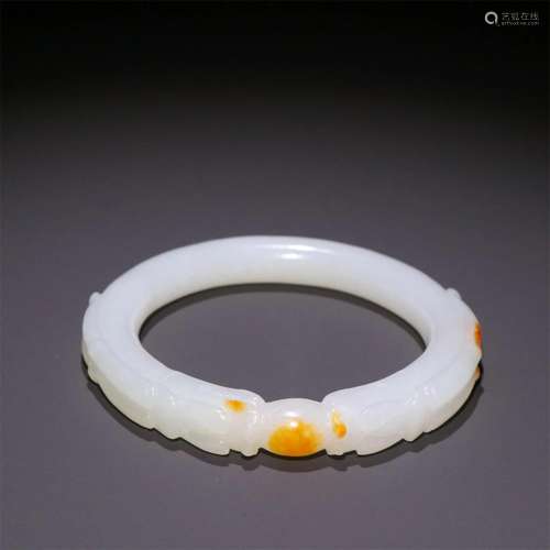 A Chinese Carved Jade Bracelet with Dragon