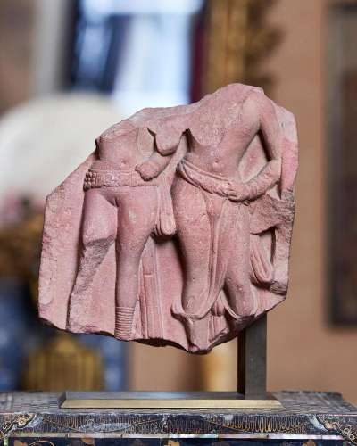 100 - A RED STANDSTONE FRAGMENT OF A MAN AND WOMAN