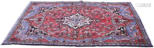 A PERSIAN HAMADAN RUG,Â the deep pink field with pale blue e...