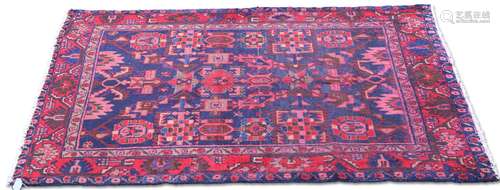 A PERSIAN LORI RUG, the dark blue field with all-over geomet...