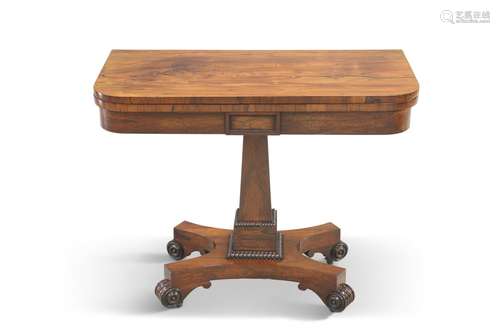 A REGENCY ROSEWOOD FOLDOVER CARD TABLE, the rectangular top ...