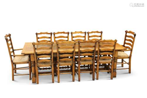 A PERIOD-STYLE OAK DINING SUITE, BY BRIGHTS OF NETTLEBED, th...