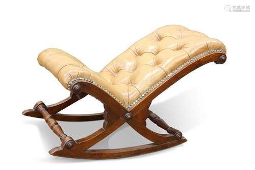 A GEORGIAN-STYLE LEATHER UPHOLSTERED ROCKING FOOTSTOOL, with...