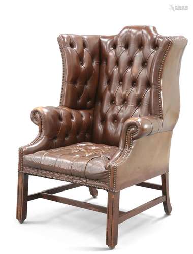 A GEORGE III-STYLE DEEP-BUTTONED BROWN LEATHER UPHOLSTERED W...