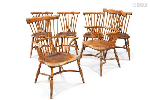 A SET OF SIX PERIOD-STYLE ELM WINDSOR CHAIRS, including a pa...