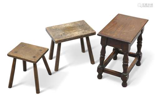 TWO PRIMATIVE COUNTRY STOOLS,Â  each with splayed legs and b...