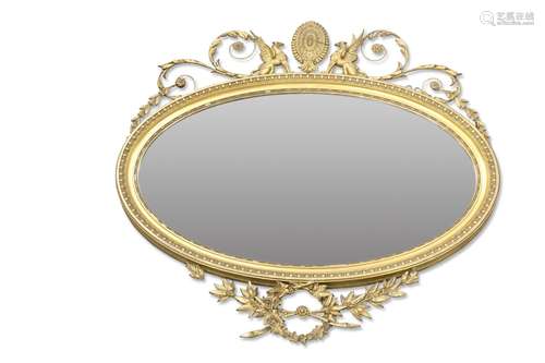 A 19TH CENTURY GILT-COMPOSTITION OVAL MIRROR, with griffin a...