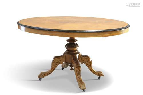 A VICTORIAN INLAID WALNUT TILT-TOP LOO TABLE, the quarter-ve...