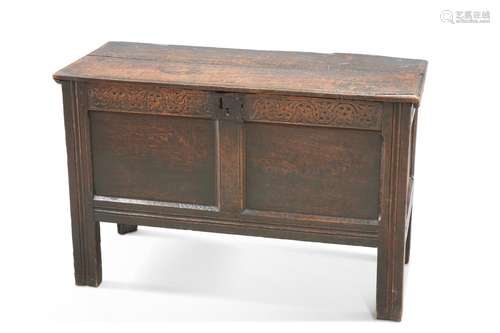 A 17TH CENTURY OAK COFFER, with carved rail above a two-pane...