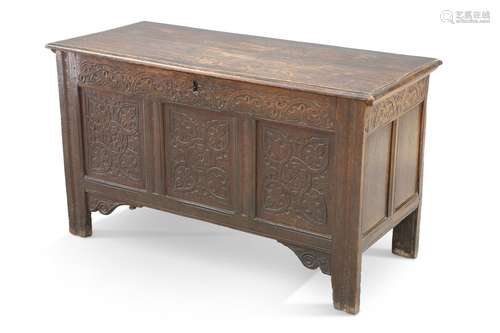 A 17TH CENTURY OAK COFFER, with lunette-carved rail above a ...