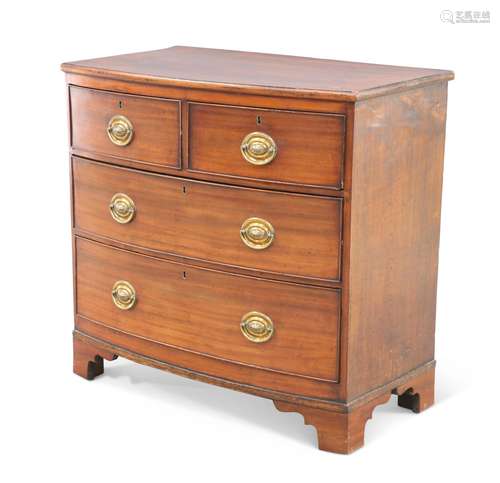 A REGENCY MAHOGANY SMALL BOW-FRONT CHEST OF DRAWERS, with tw...