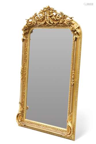 A PERIOD-STYLE GILT-COMPOSITION MIRROR, the frame boldly mou...