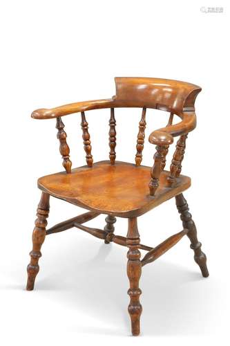 A VICTORIAN ELM SMOKER'S BOW CHAIR, raised on splayed b...