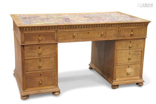 A LATE 19TH CENTURY OAK DESK, the moulded rectangular top wi...