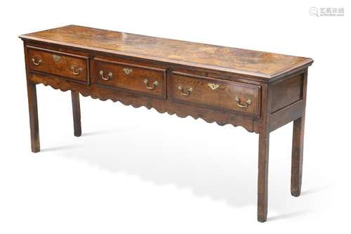 A GEORGE III MAHOGANY BANDED OAK DRESSER BASE, the moulded r...