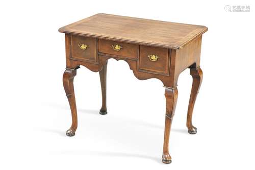 AN 18TH CENTURY FEATHERBANDED WALNUT LOWBOY, the moulded rec...