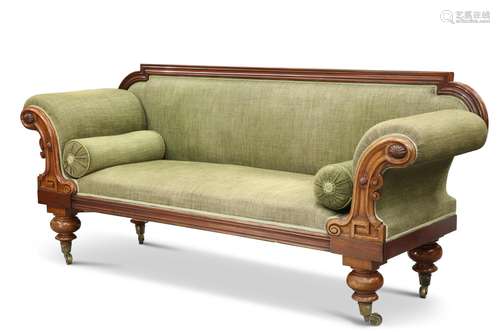 A VICTORIAN MAHOGANY SETTEE, the out-scrolled ends carved wi...