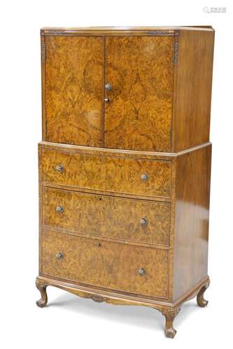 A 1930S BURR WALNUT TALLBOY, bow-fronted, the upper section ...