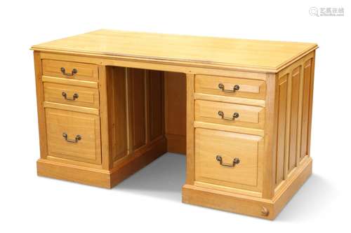 COXWOLD CABINET MAKERS, A UNICORN MAN OAK DESK, the moulded ...