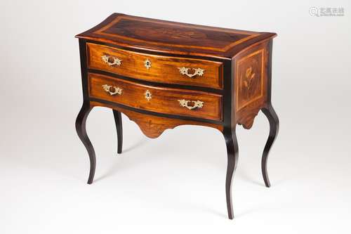 A rosewood chest of drawers