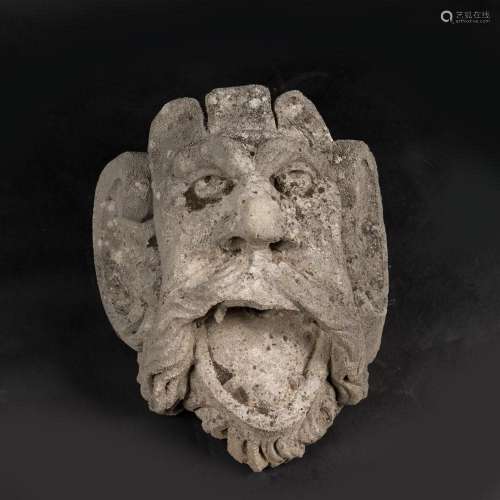 Grotesque male stone hat