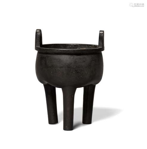 A silver-inlaid bronze tripod censer