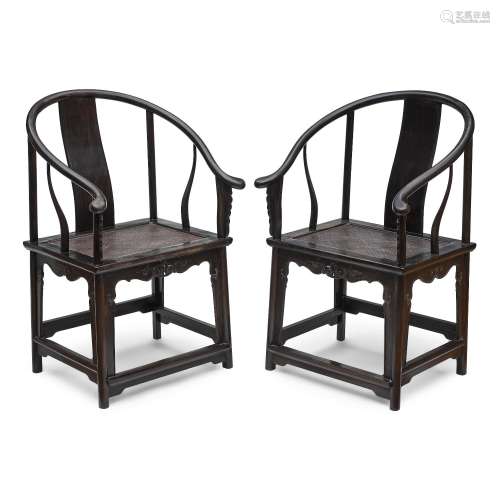 A pair of zitan and mixed wood horseshoe-back armchairs, qua...
