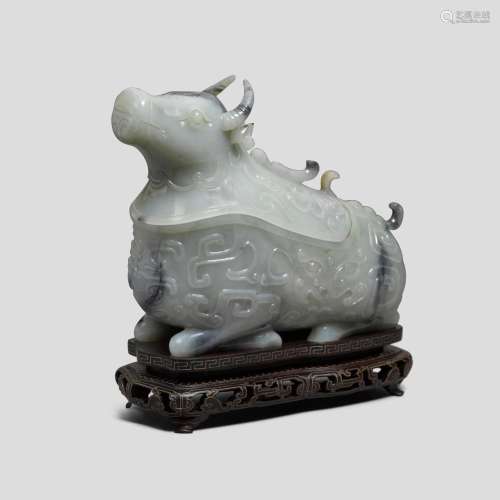 A celadon and gray jade archaistic guang-form vessel and cov...