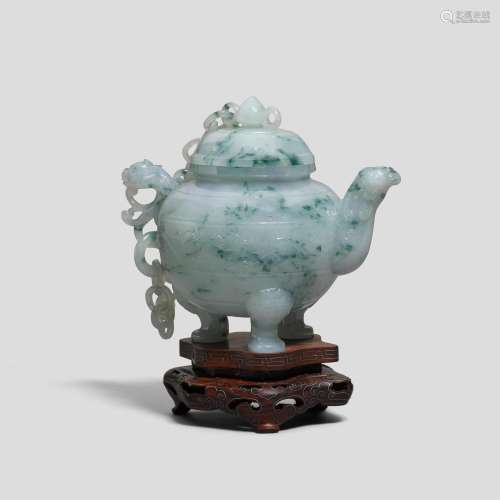 A dappled pale green jadeite teapot and cover