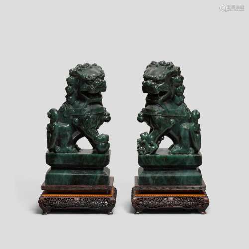 A pair of spinach-green jade 'Buddhist lions'