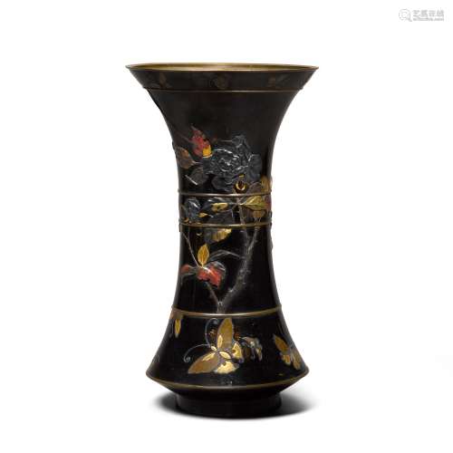 A mixed metal 'butterfly' beaker vase