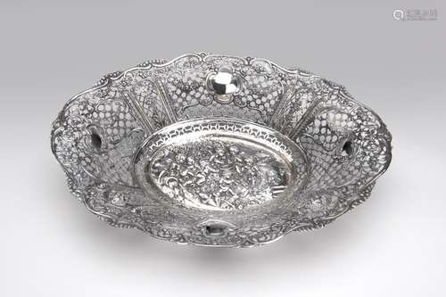 A large silver bread basket