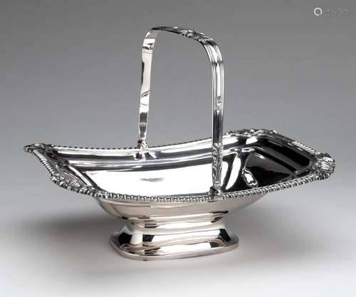 An English silver cake basket with swing handle