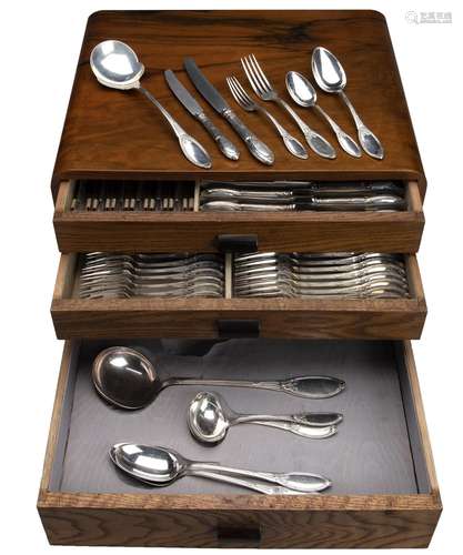 A collection of French silver flatware in wooden canteen