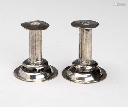 A pair of miniature candlesticks