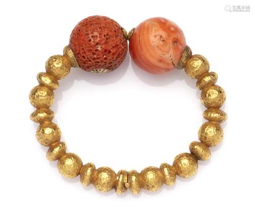 An 18k gold coral bangle