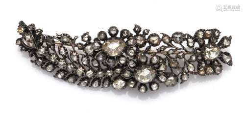 An antique silver diamond brooch