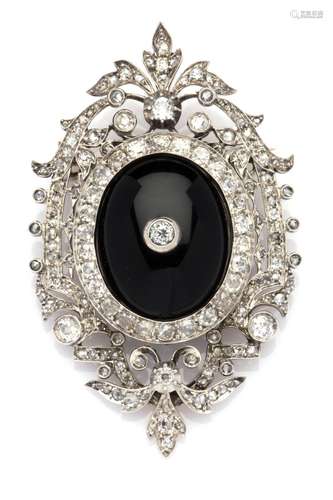 An antique 18k gold and silver onyx and diamond brooch