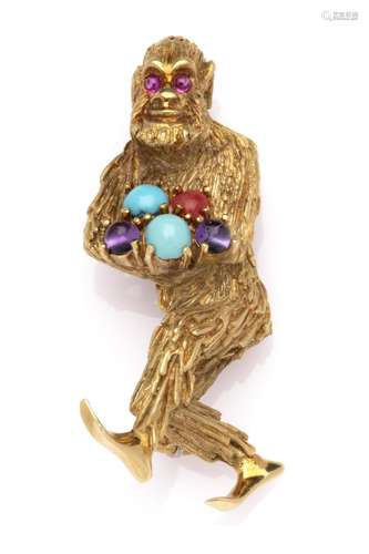 A whimsical 18k gold and gem set animal brooch