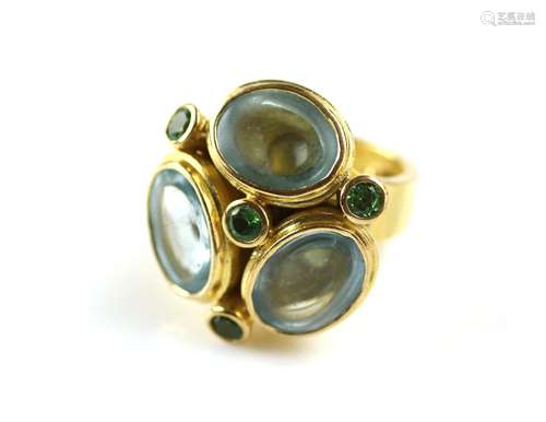 An 18k gold topaz and green garnet cocktail ring, by Jacob