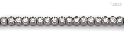 An 18k white gold diamond line bracelet