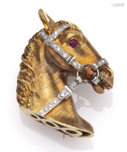 An 18k gold ruby and diamond horse brooch