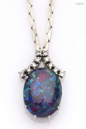 A 14k white gold opal and diamond necklace