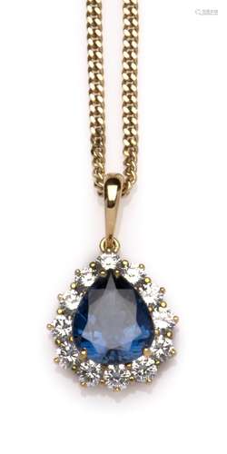 A 14k gold sapphire and diamond pendant on a chain