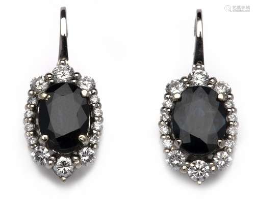 A pair of 18k white gold sapphire and diamond earrings