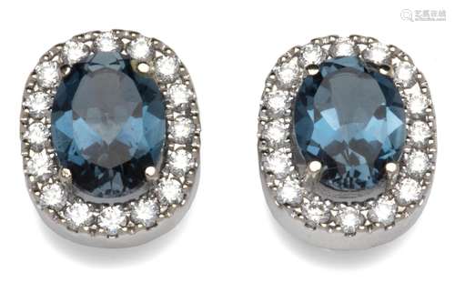 A pair of 18k white gold blue topaz and diamond earrings