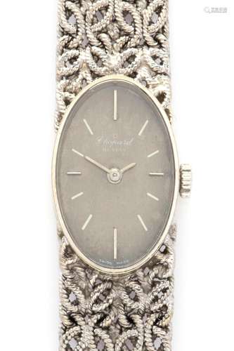 An 18k white gold lady's bracelet watch, by Chopard.