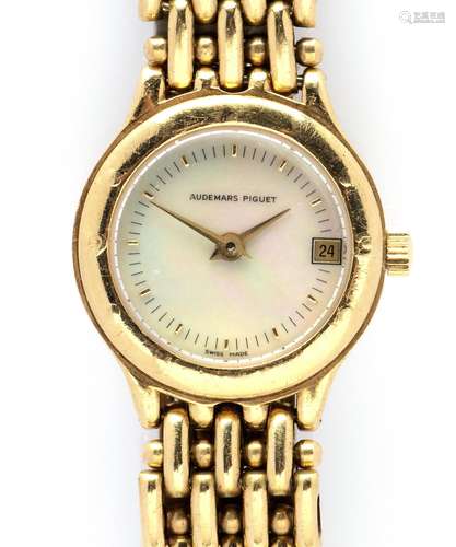 An 18k gold lady's wristwatch with date, by Audemars Pi...