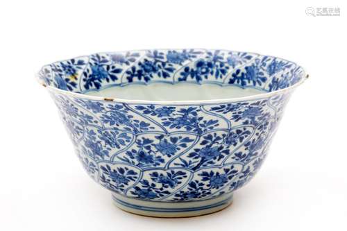 A blue and white moulded swirl flaring bowl